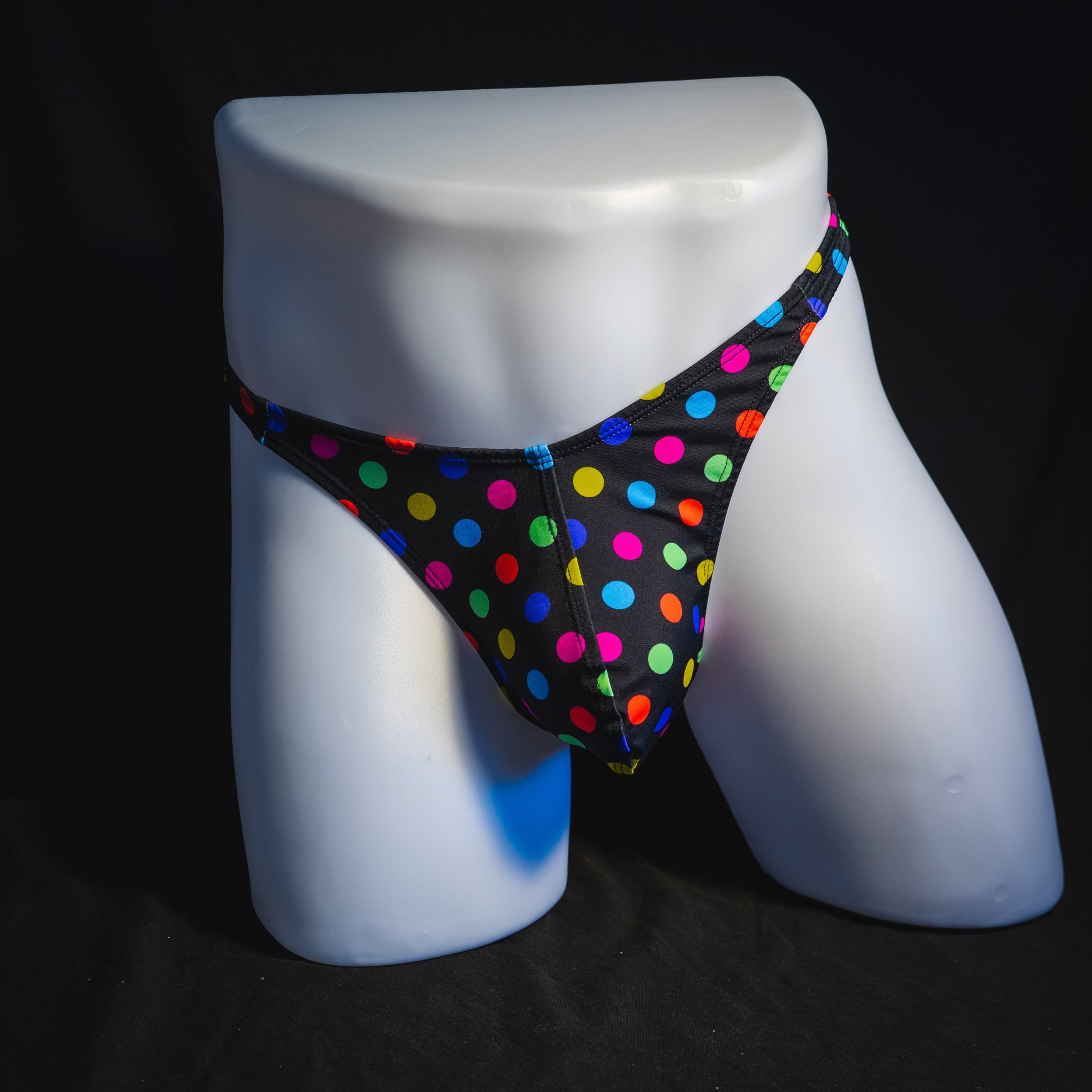 Men's multi colored polka dot thong underwear, classic cut, full front view.