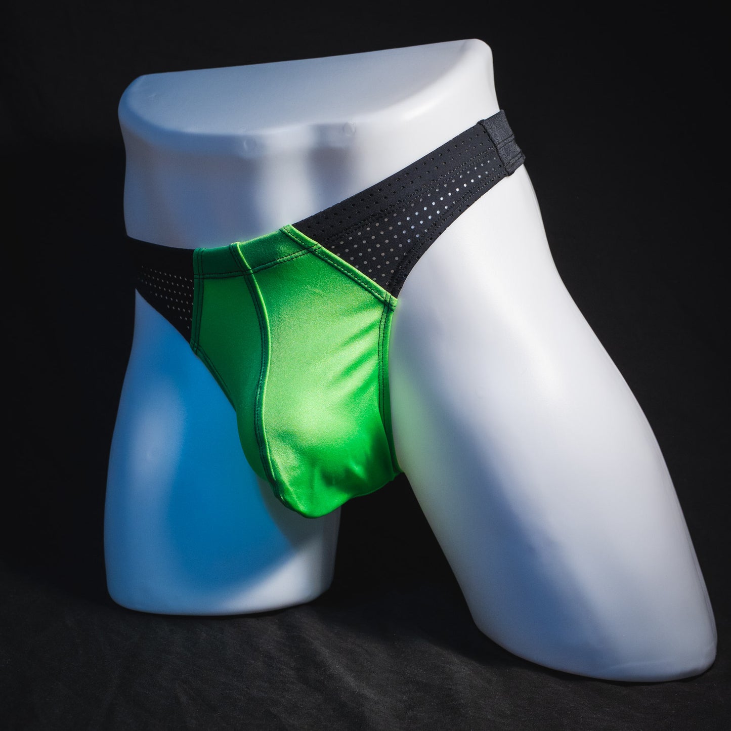Men's neon green and black mesh athletic thong underwear, full angled front view.