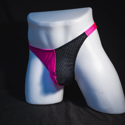 Men's bright pink and black mesh thong underwear, classic cut, full angled front view.