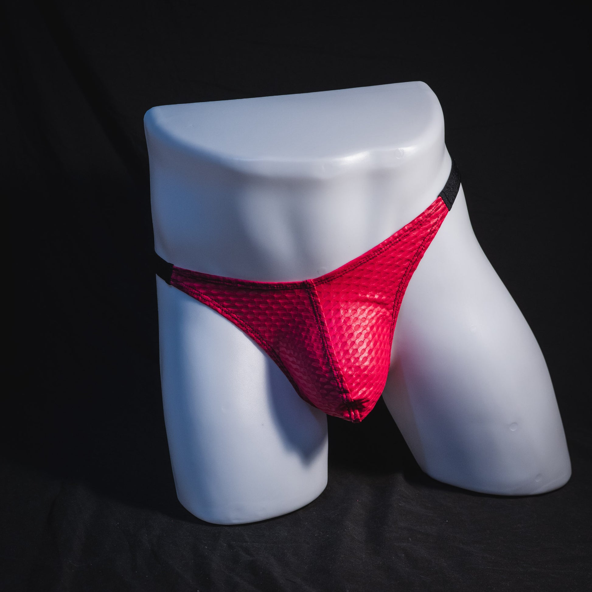 Men's pink athletic mesh thong underwear, classic cut, Full front view.