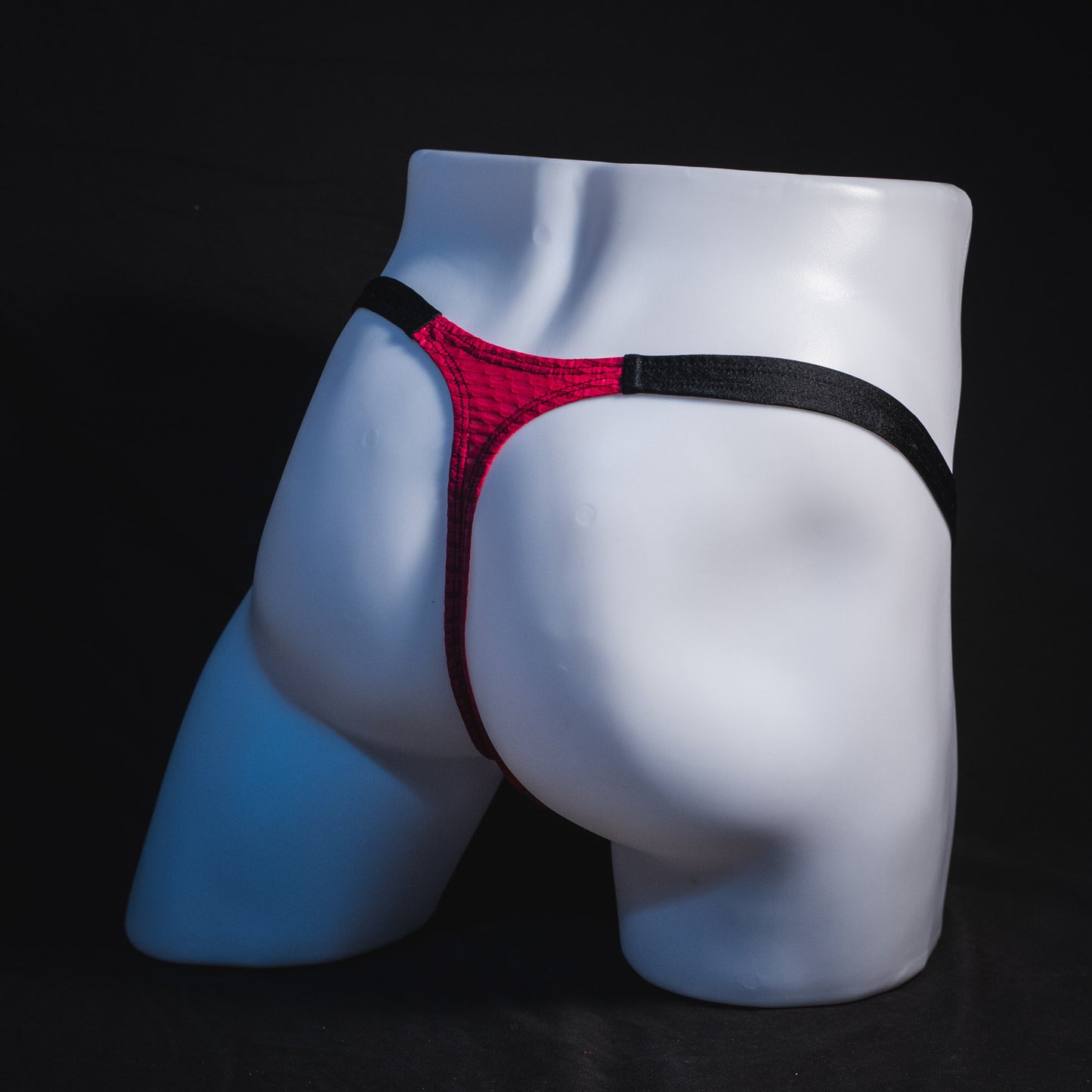 Men's pink athletic mesh thong underwear, classic cut, Full angled rear view