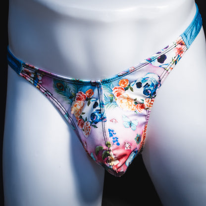 Men's pink floral with skulls and blue straps thong underwear, classic cut, Front view