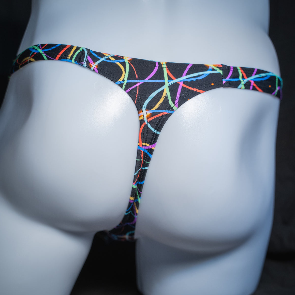 Men's colorful lines thong, classic cut, rear view.