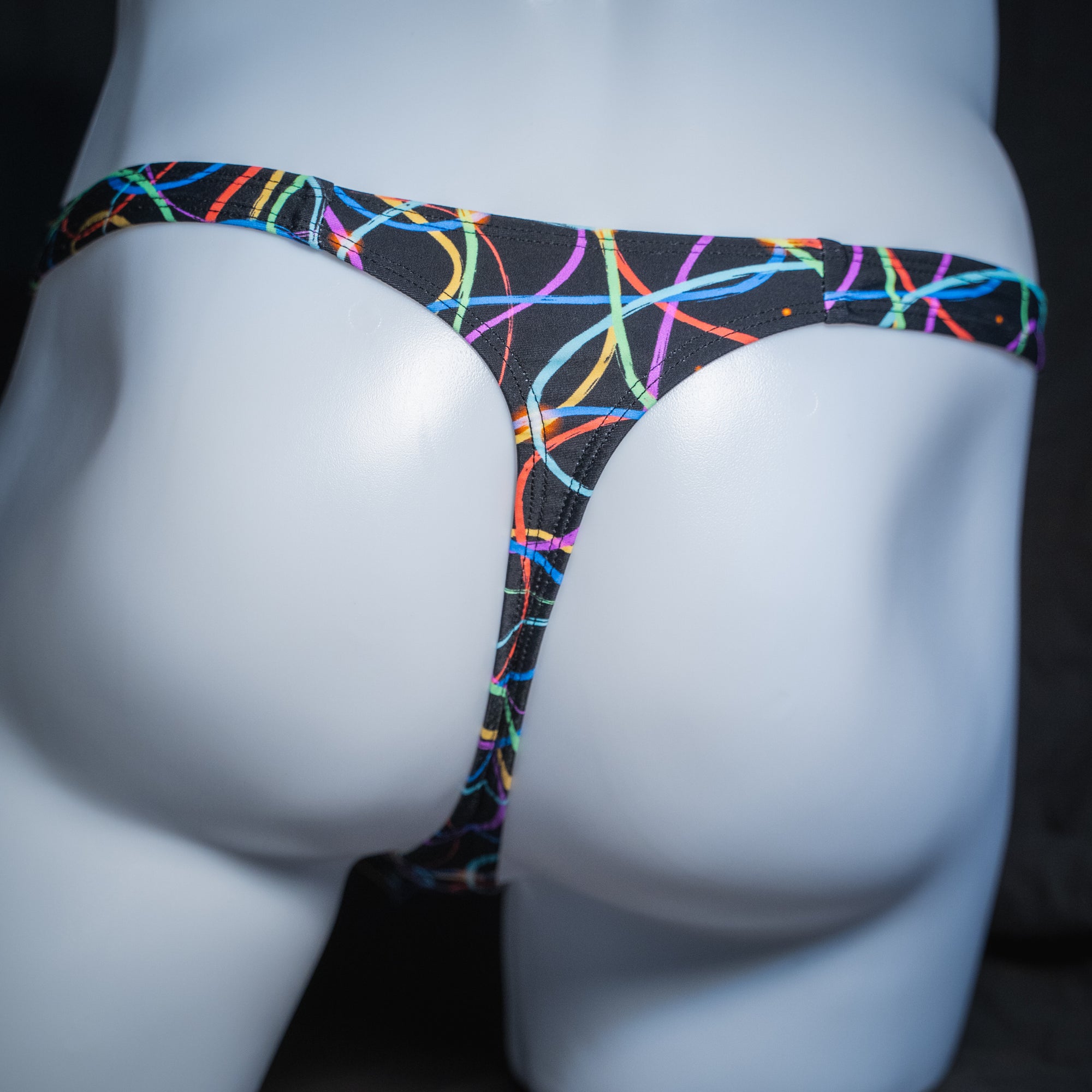Men's colorful lines thong, classic cut, rear view.