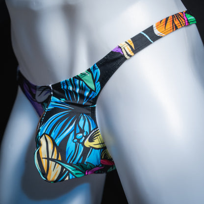 Men's colorful hip floral thong, slim cut, angled front view.