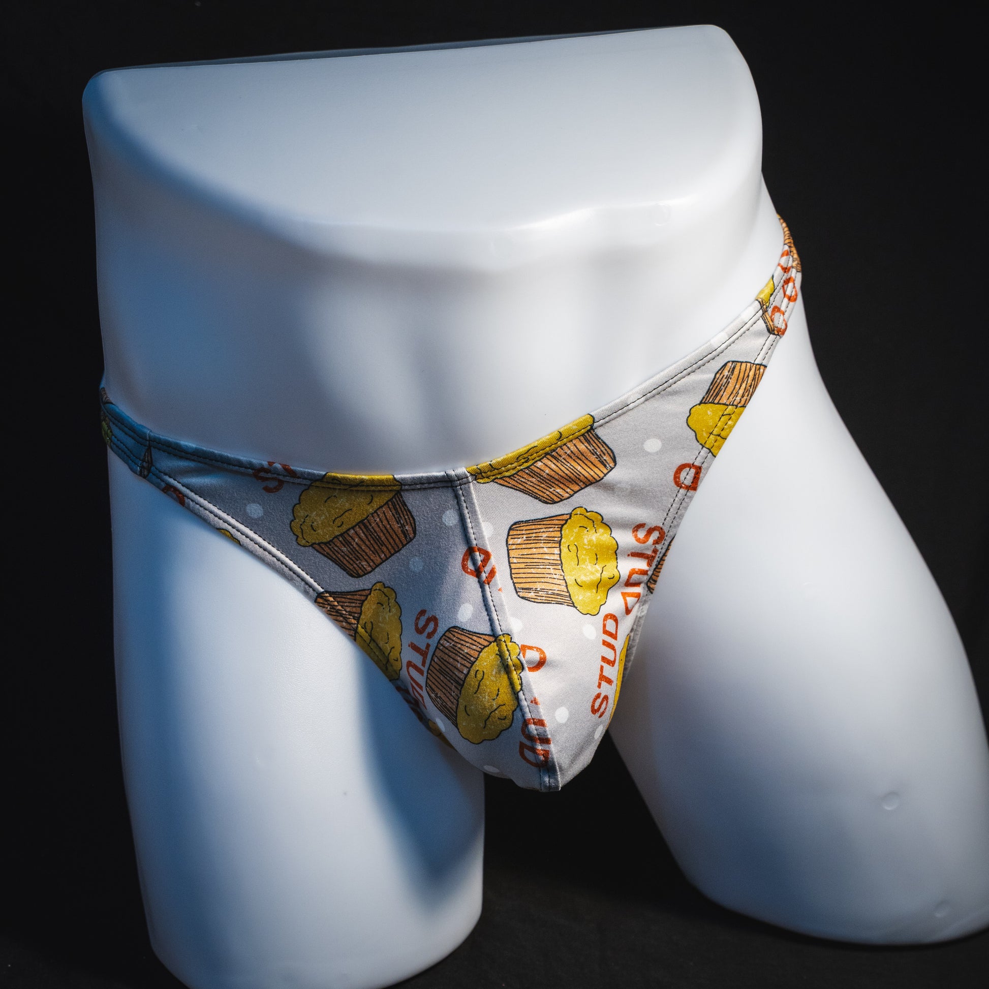 Men's stud muffin thong underwear, classic cut, full front view.