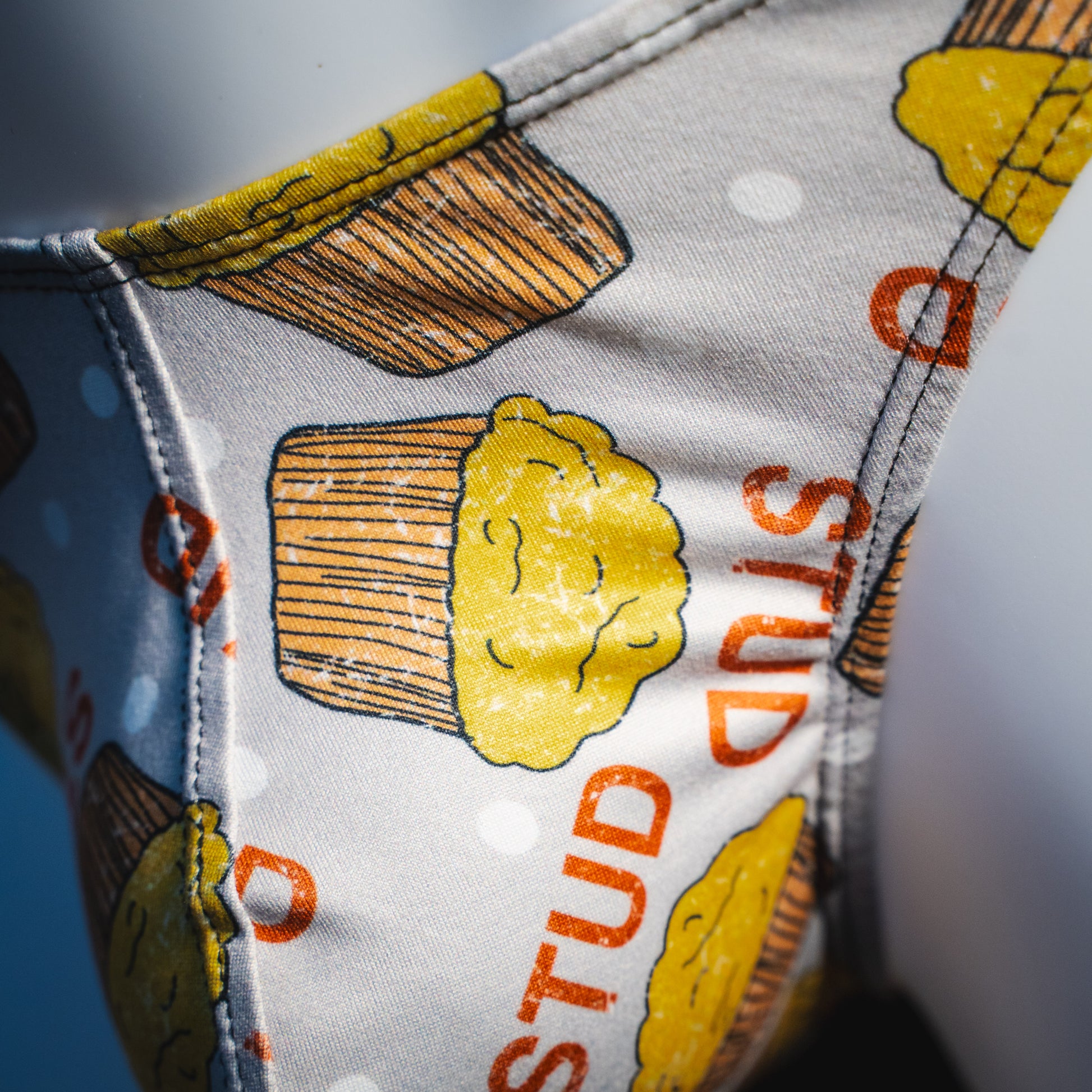 Men's stud muffin thong underwear, classic cut, front detail view.