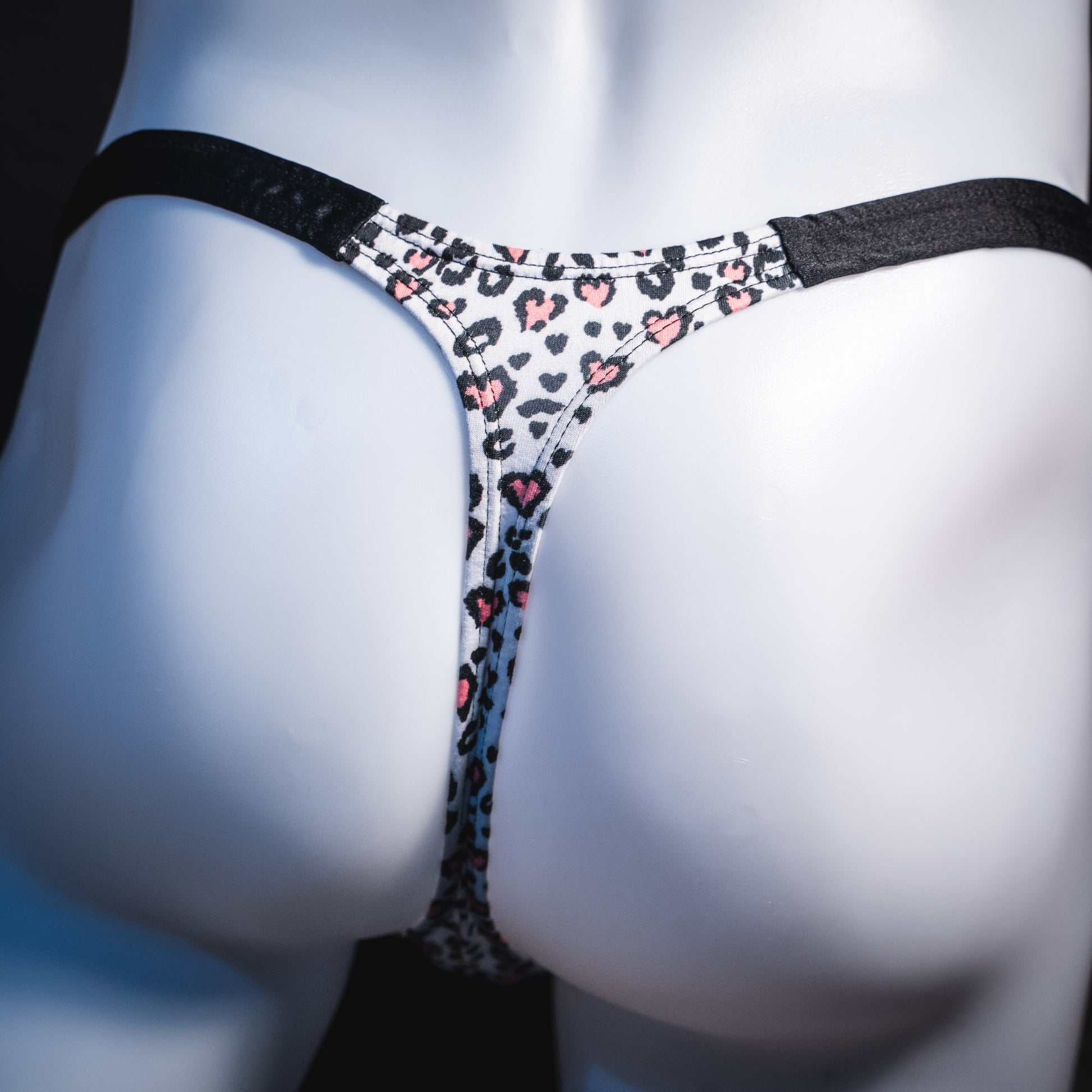 Men's white cheetah with pink hearts thong underwear, classic cut, rear view