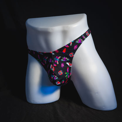 Men's black with pink insects thong underwear, Classic cut, full angled front view.