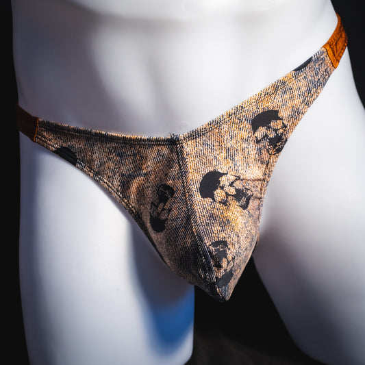 Men's black skulls on brown thong underwear, Classic cut, front view.