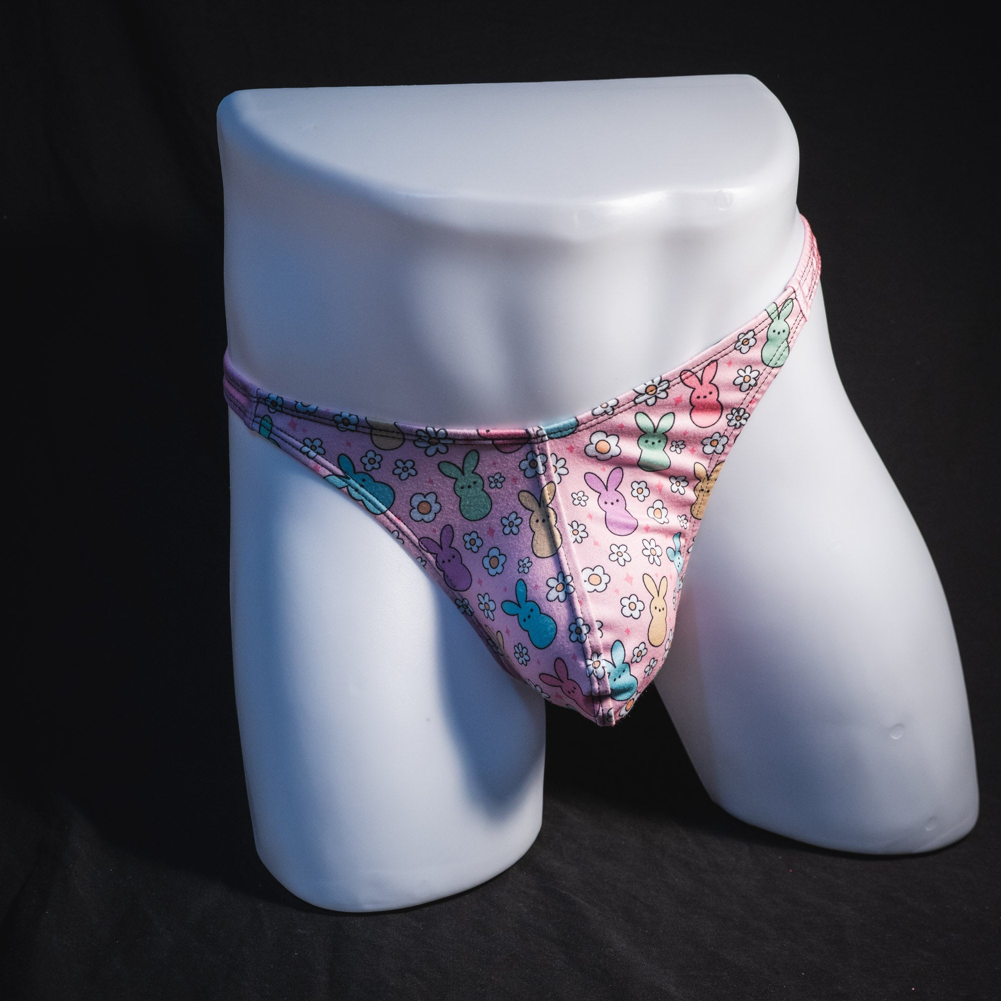 Men's pink easter bunnies thong underwear, classic cut, full front view.