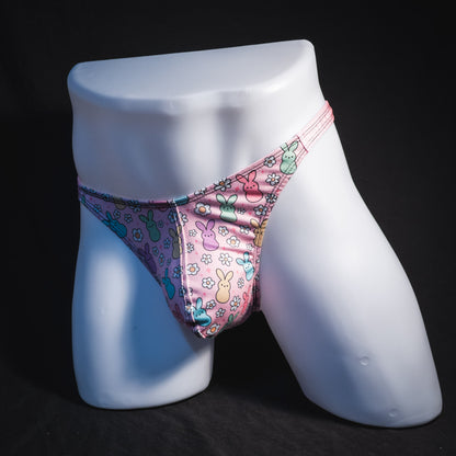 Men's pink easter bunnies thong underwear, classic cut, full angled front view.