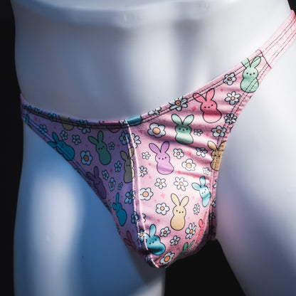 Men's pink easter bunnies thong underwear, classic cut, angled front view.