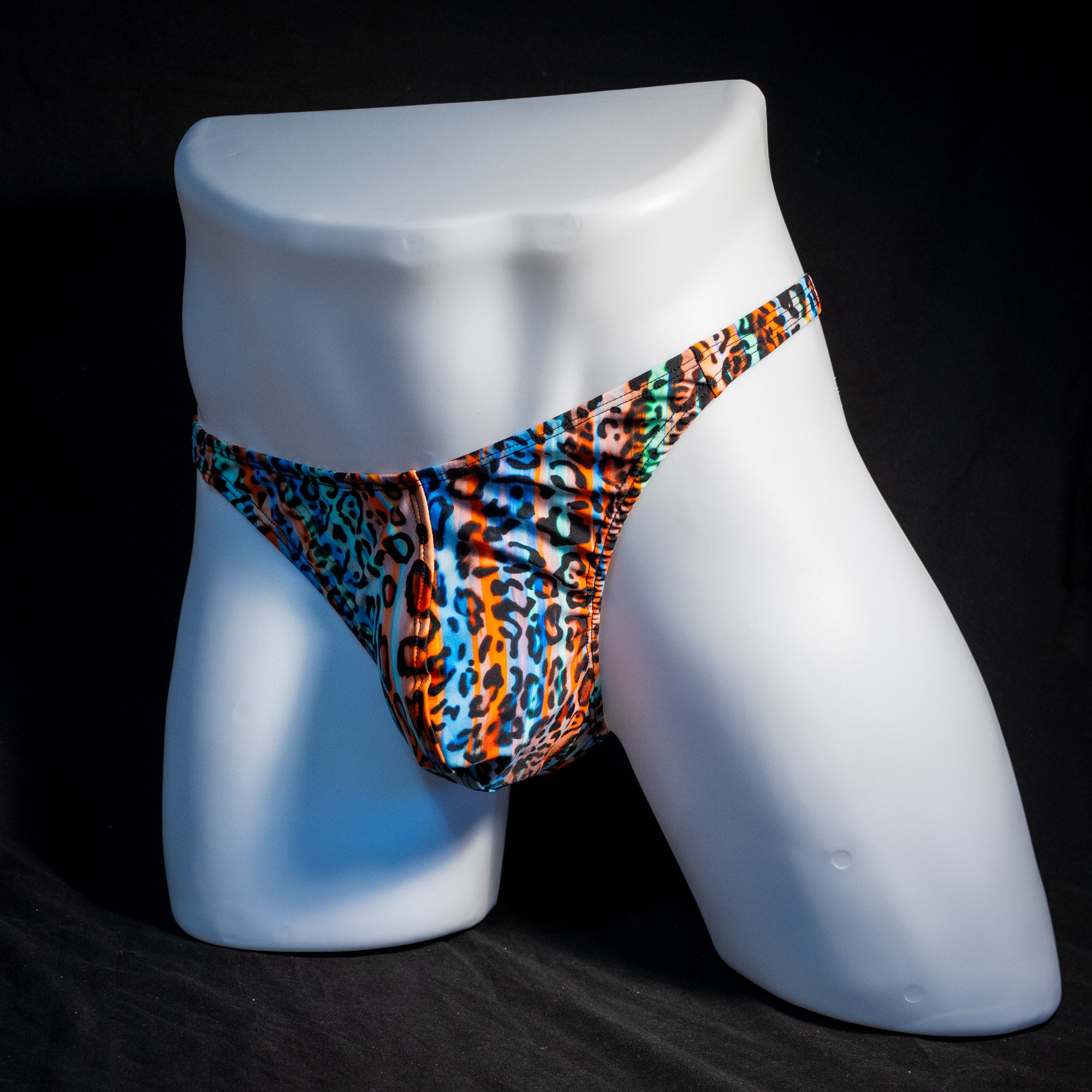 Men's colorful cheetah thong underwear, classic cut angled full front view.