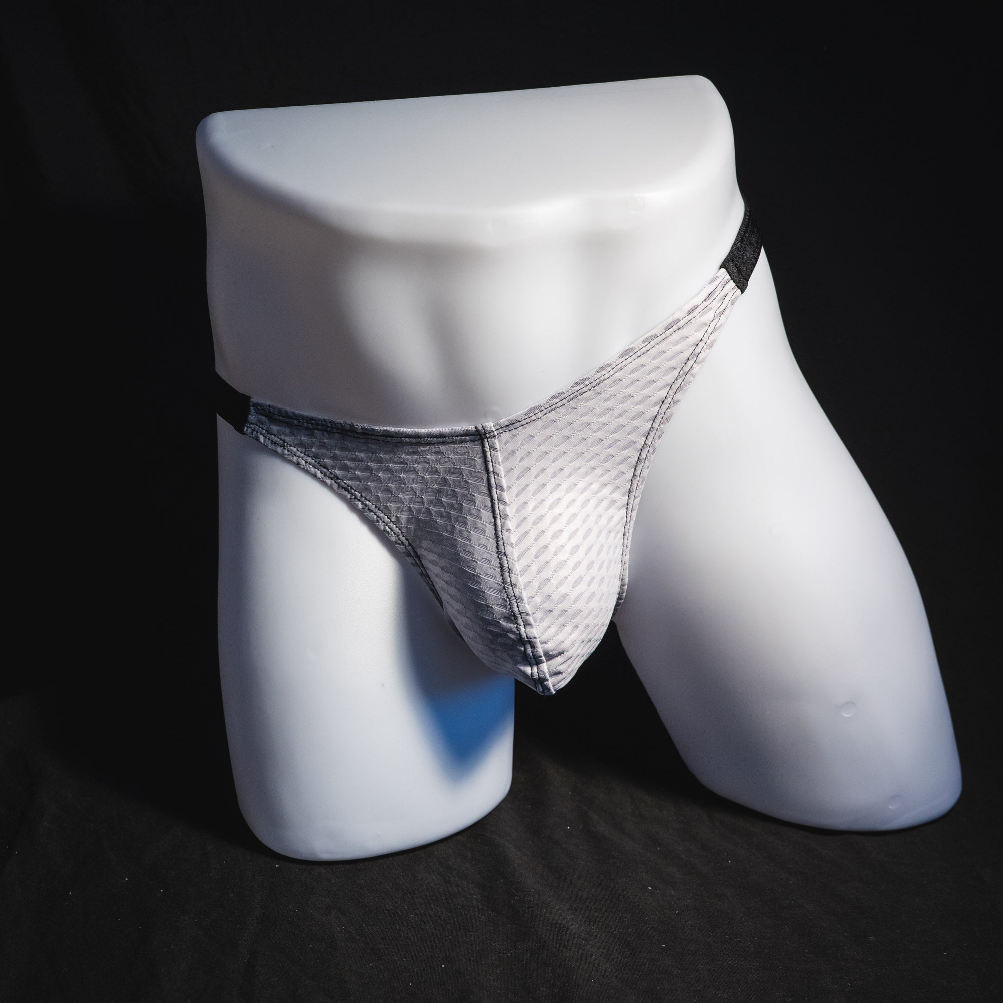 Men's ash white and black athletic mesh thong underwear, classic cut, front view.