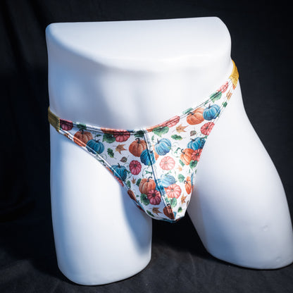Men's colorful autumn pumpkins thong underwear, classic cut, front view.