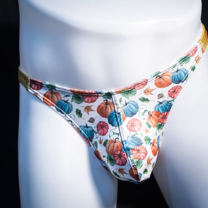 Men's colorful autumn pumpkins thong underwear, classic cut, front view.