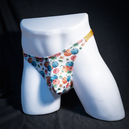 Men's colorful autumn pumpkins thong underwear, classic cut, front view.