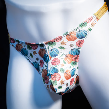 Men's colorful autumn pumpkins thong underwear, classic cut, front view.