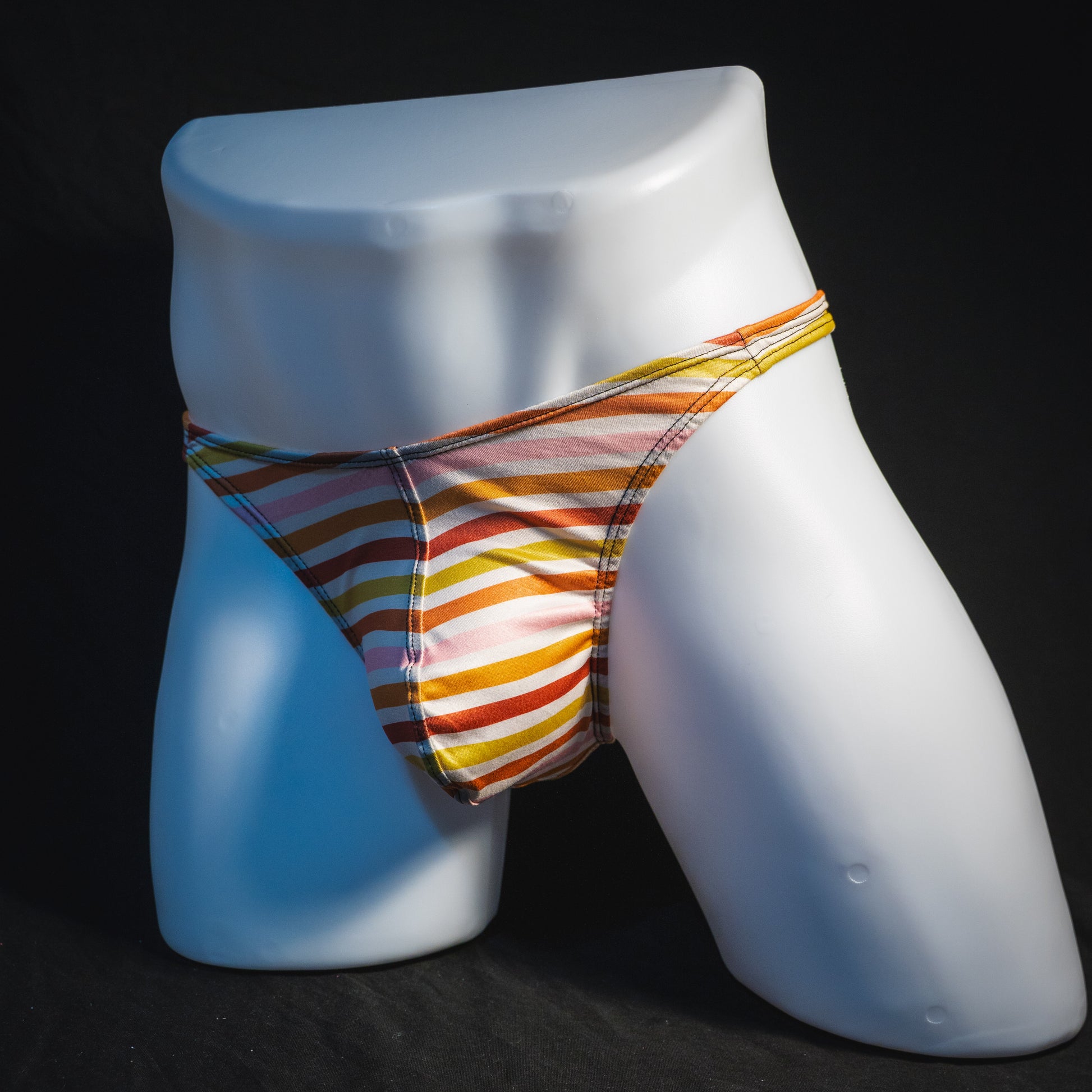 Men's Autumn striped thong underwear, classic cut, full angled front view.