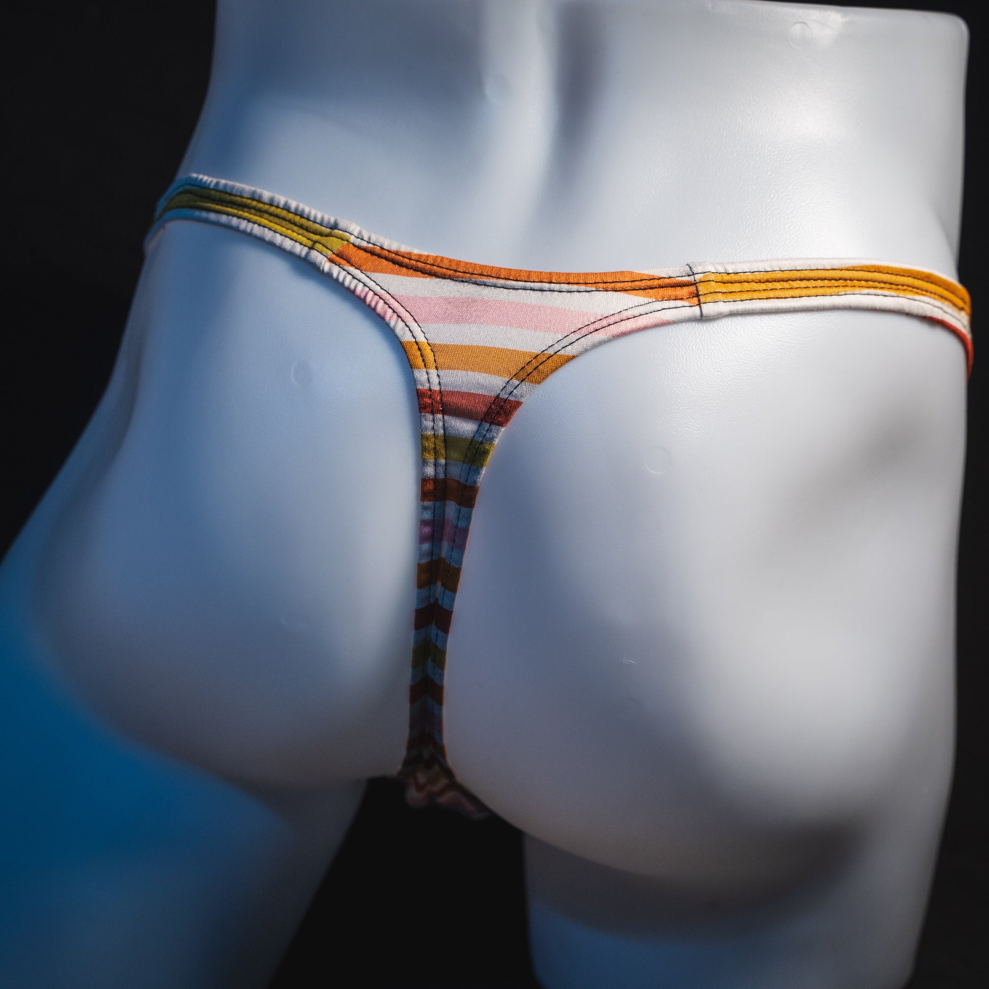 Men's Autumn striped thong underwear, classic cut, rear view.