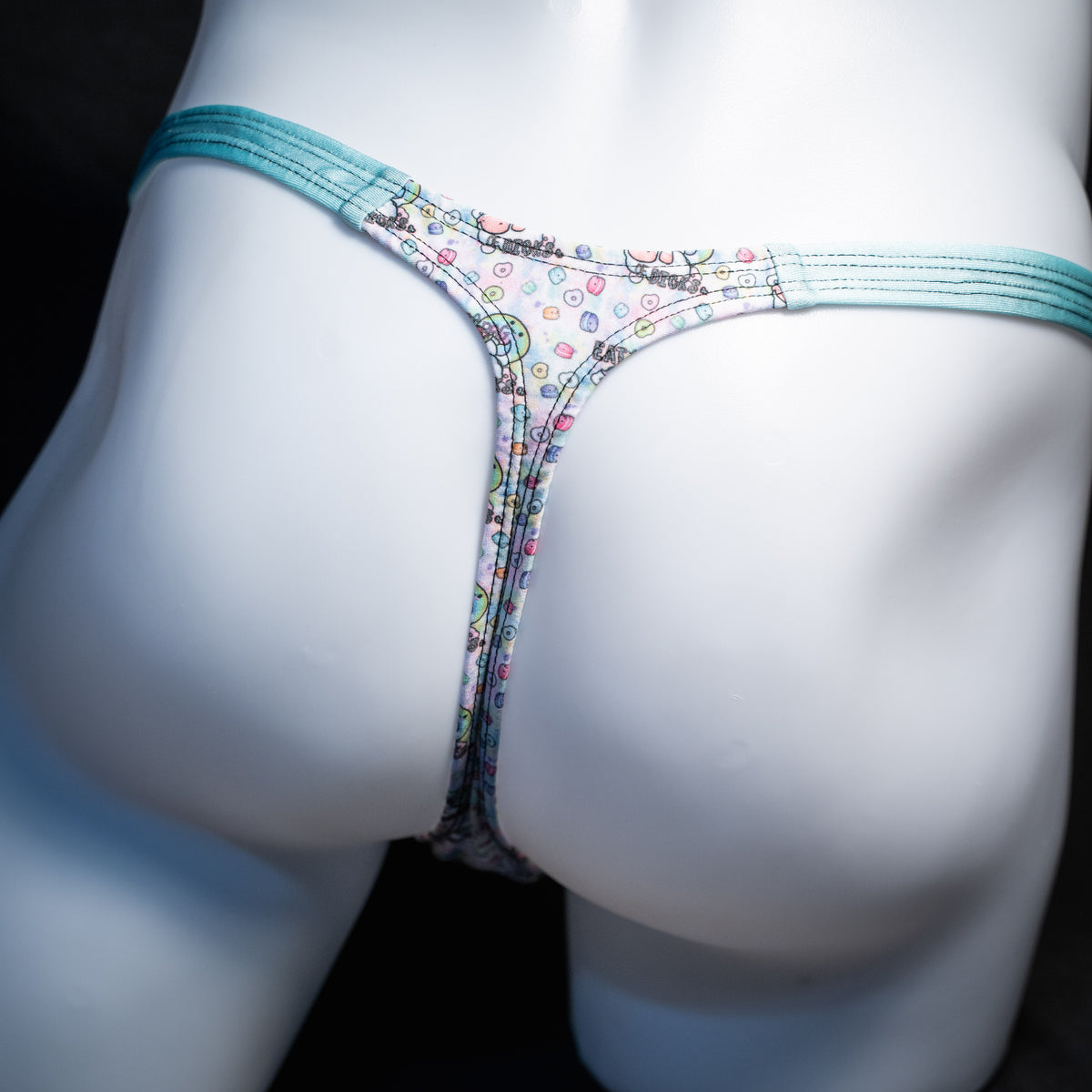 Men's bag of dicks thong underwear, classic cut, rear view.