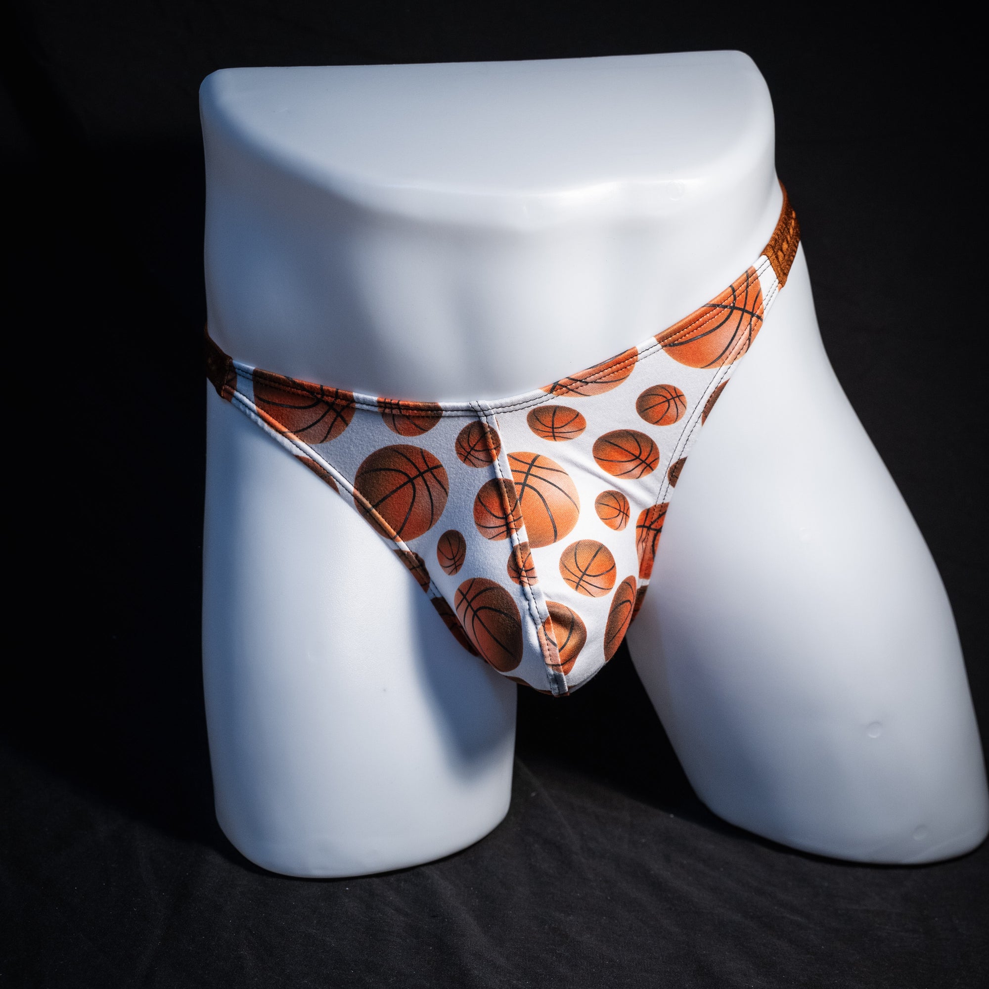 Men's basketball themed thong underwear, classic cut, front view.