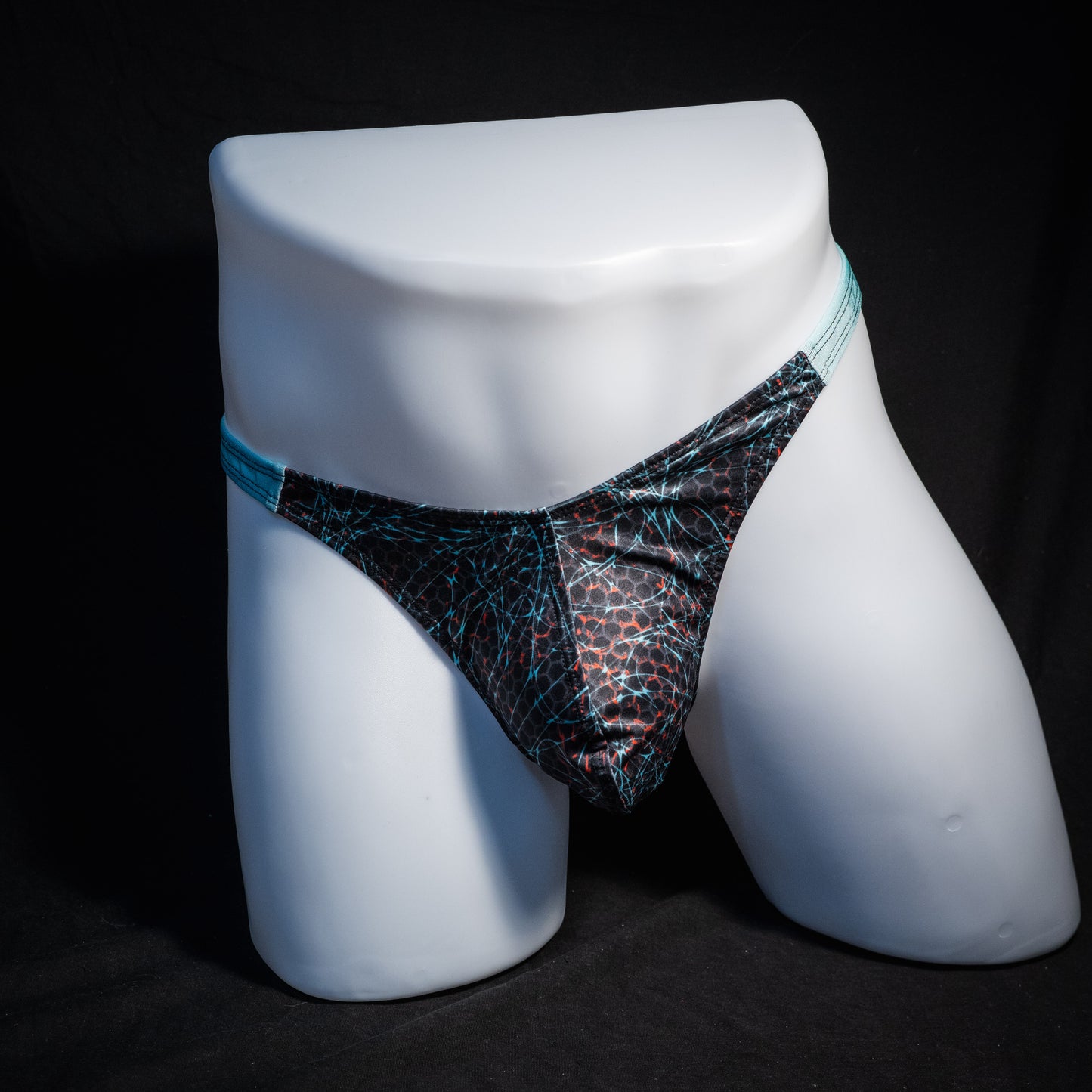 Men's black and blue thong underwear, classic cut, front view.
