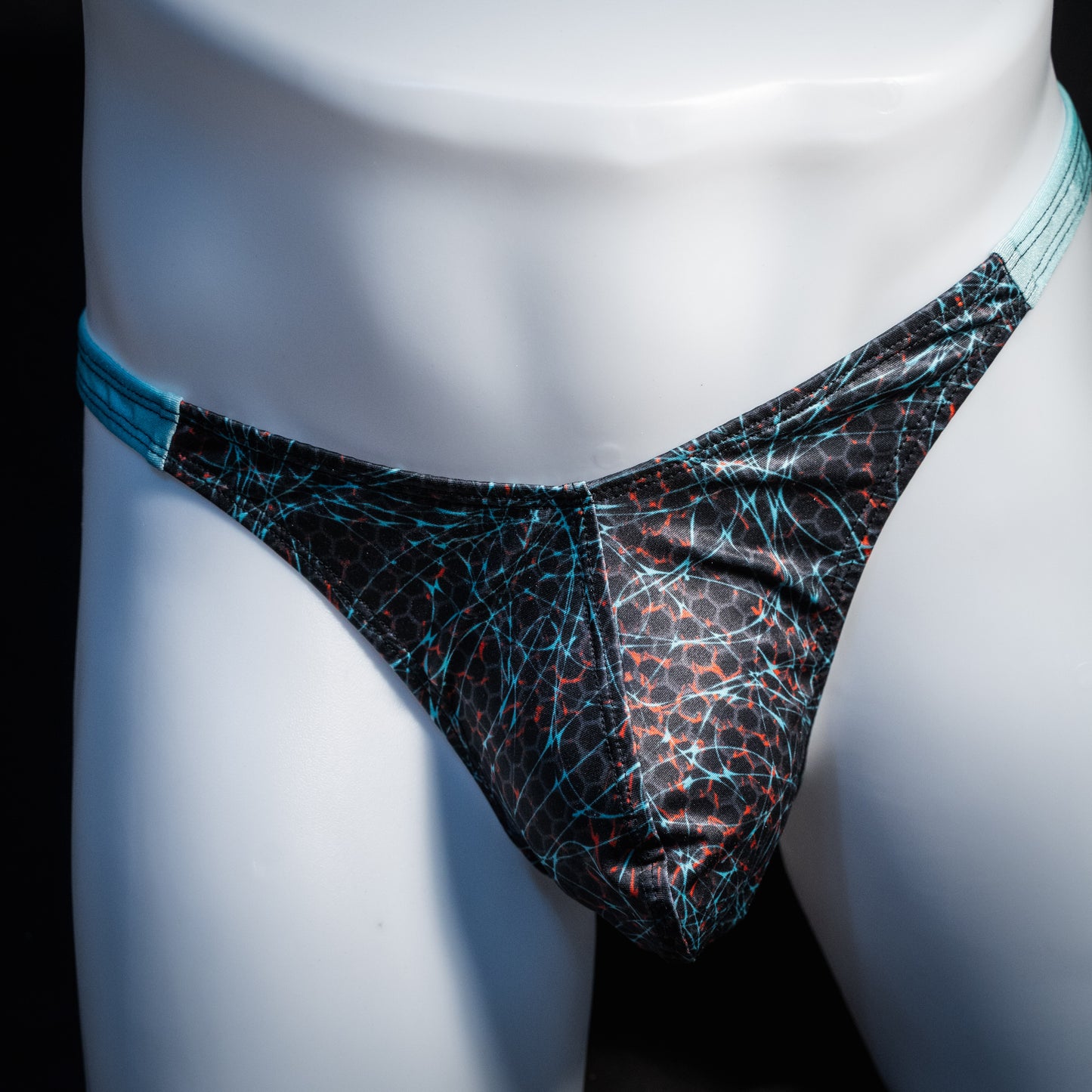 Men's black and blue thong underwear, classic cut, front view.