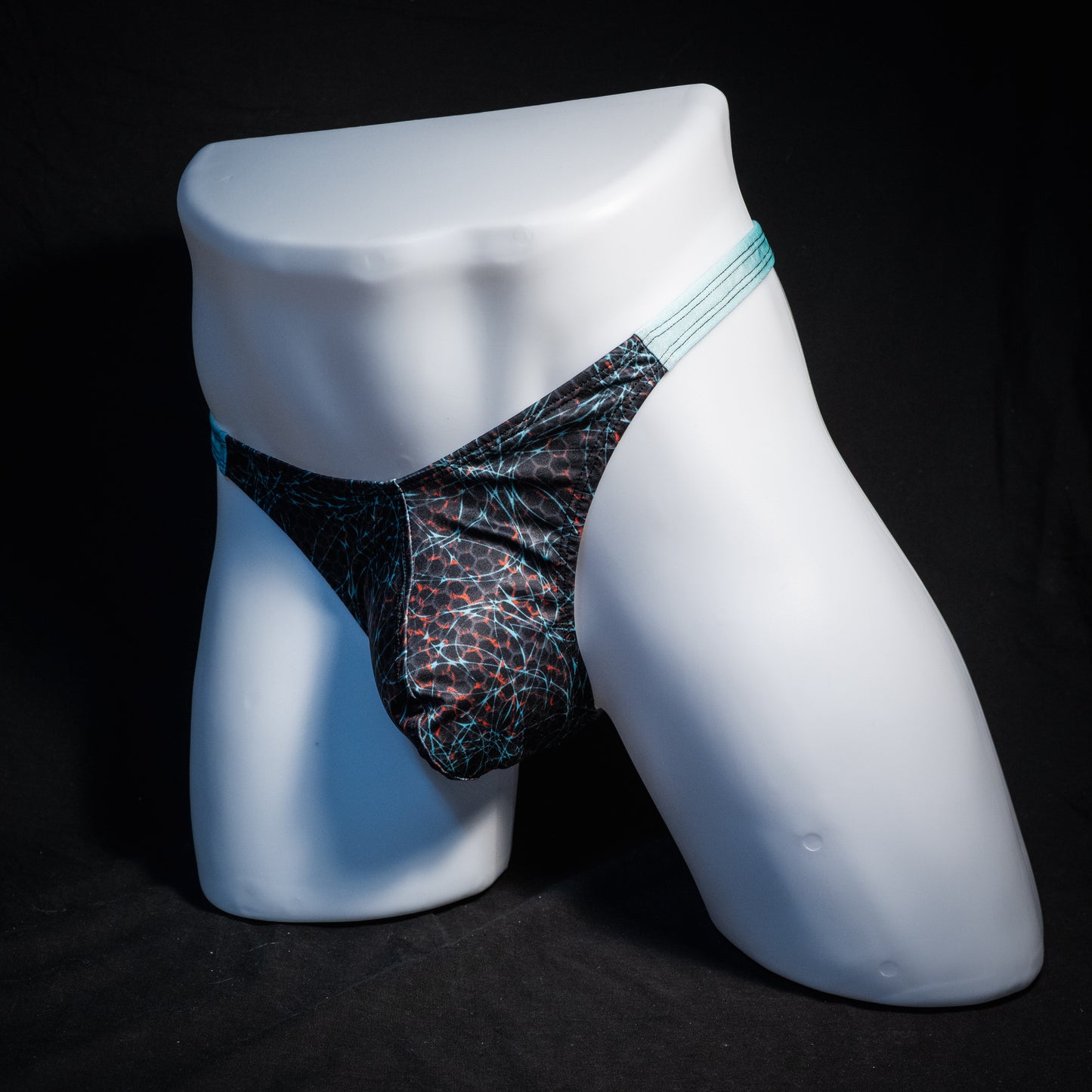 Men's black and blue thong underwear, classic cut, front view.