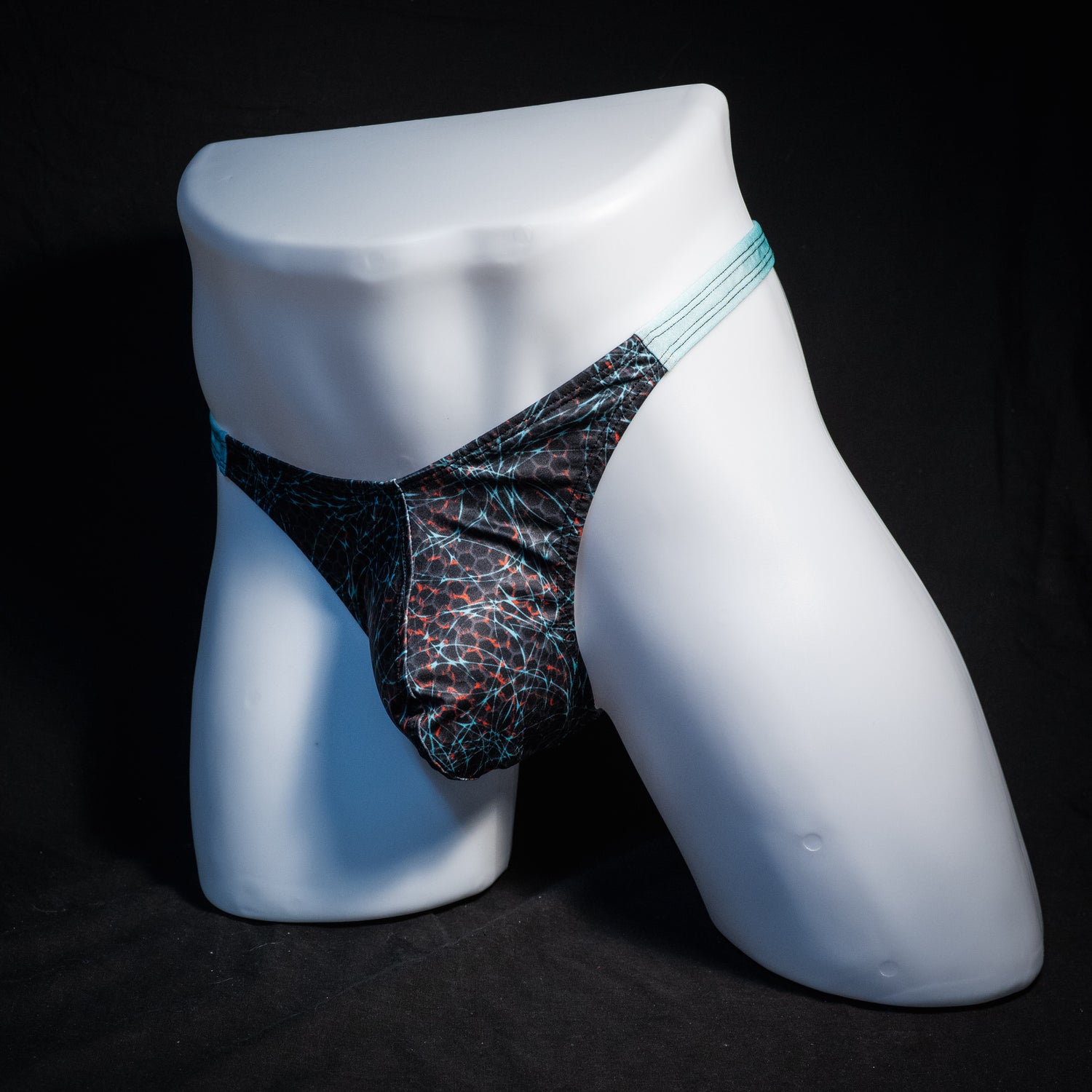 Men's black and blue thong underwear, classic cut, front view.