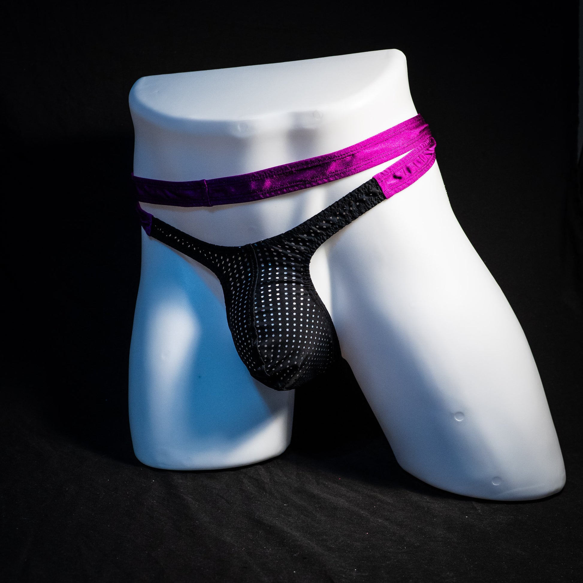 Men's double strap black mesh with purple straps, thong underwear, tower cut, full front angled view.