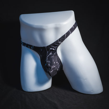 Men's black and white marble thong underwear, tower cut, full angled front view.