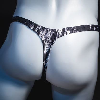 Men's black and white marble thong underwear, tower cut, rear view.