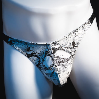 Men's black and white snakeskin thong underwear, classic cut, front view.