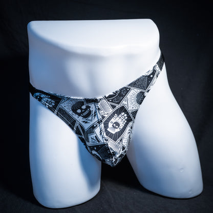 Men's black and white tarot thong underwear, classic cut, front view.