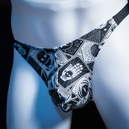 Men's black and white tarot thong underwear, classic cut, front view.