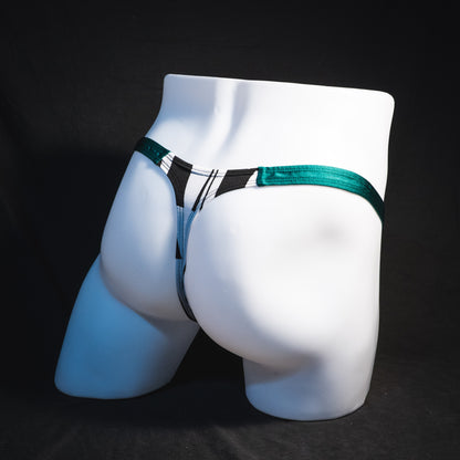 Men's black and white geometric thong underwear with green side straps, classic cut, Full angled rear view