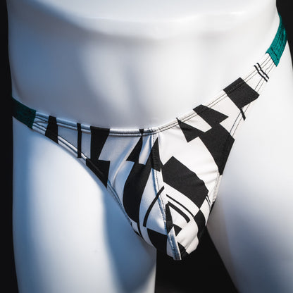 Men's black and white geometric thong underwear with green side straps, classic cut, Front view