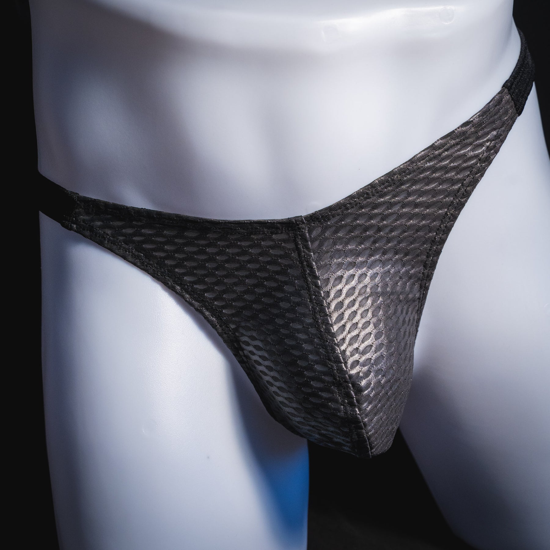 Men's black athletic mesh thong underwear, classic cut, front view.