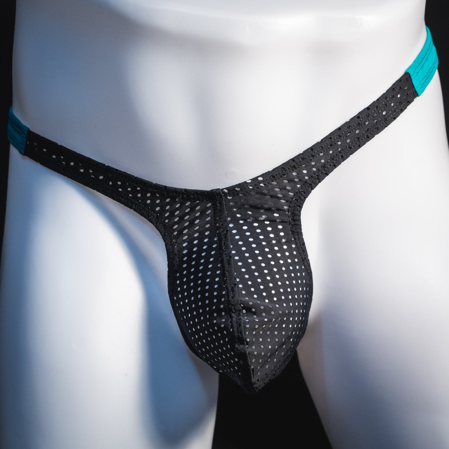 Black mesh with teal waistband, men's thong underwear, tower cut, front view.