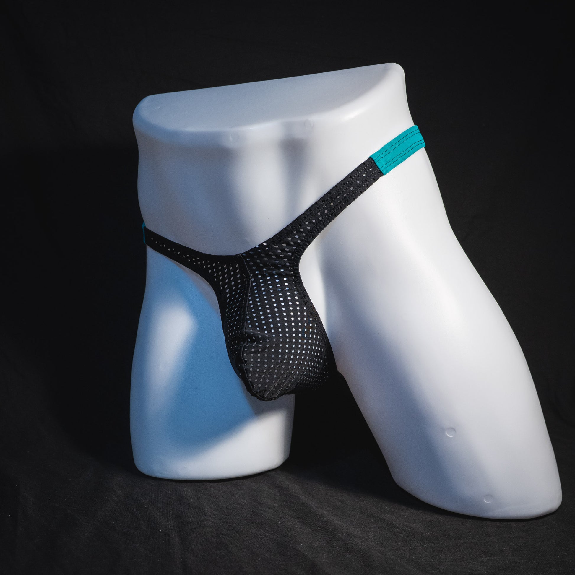 Black mesh with teal waistband, men's thong underwear, tower cut, full angled front view.