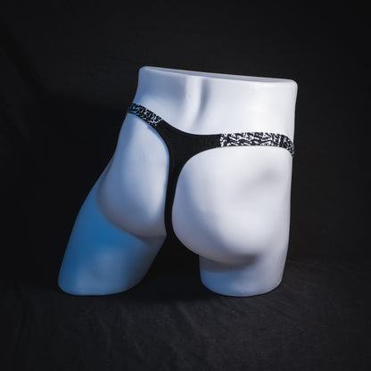 Men's black modal thong underwear, classic cut, Full angled rear view