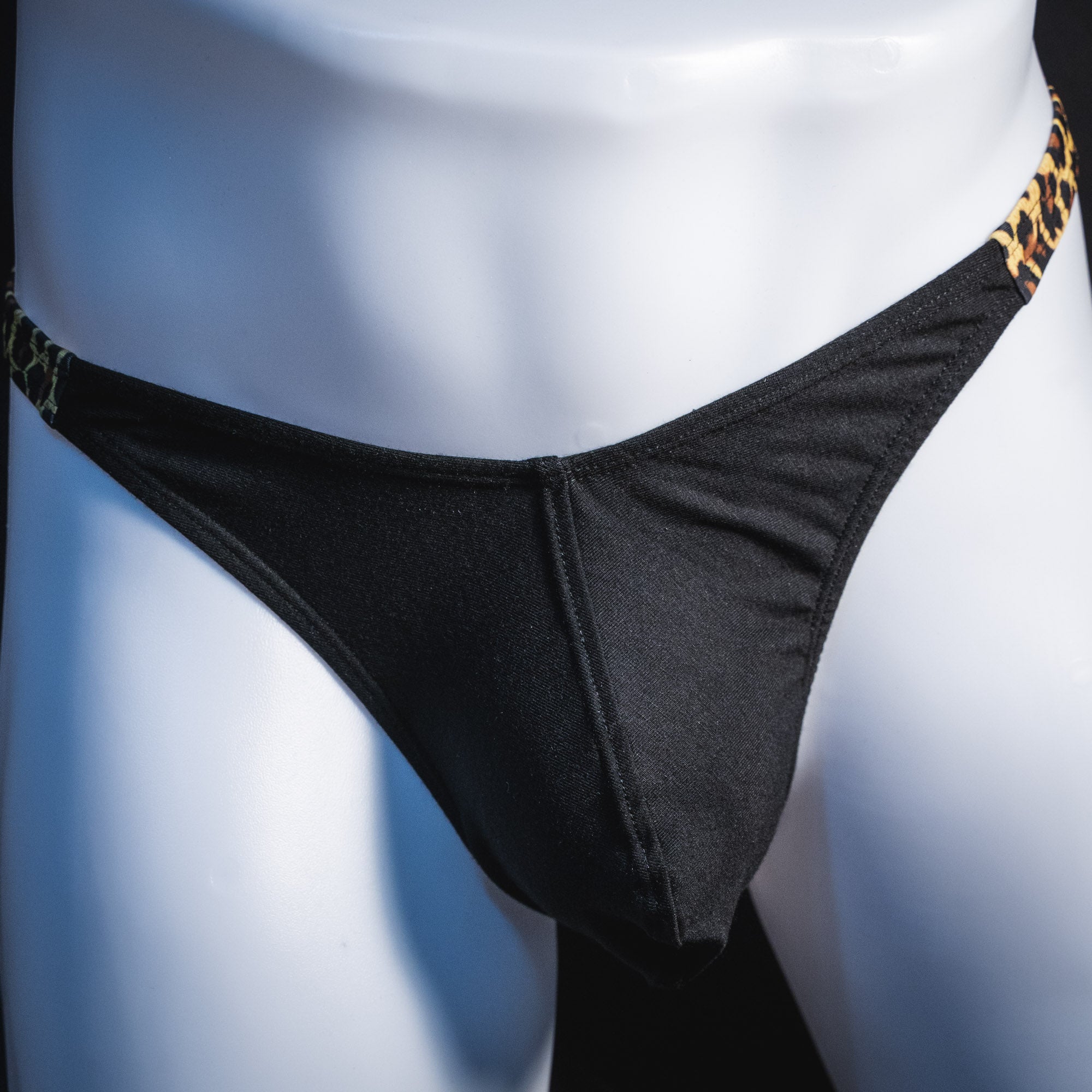 Men's black and leopard modal thong underwear, classic cut, front view