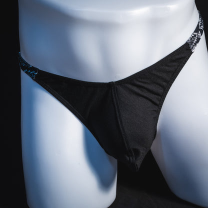 Men's black and white snakeskin thong underwear, classic cut, front view.