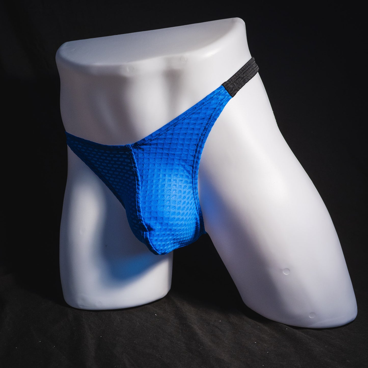 Men's blue and black athletic mesh thong underwear, classic cut, full angled front view.
