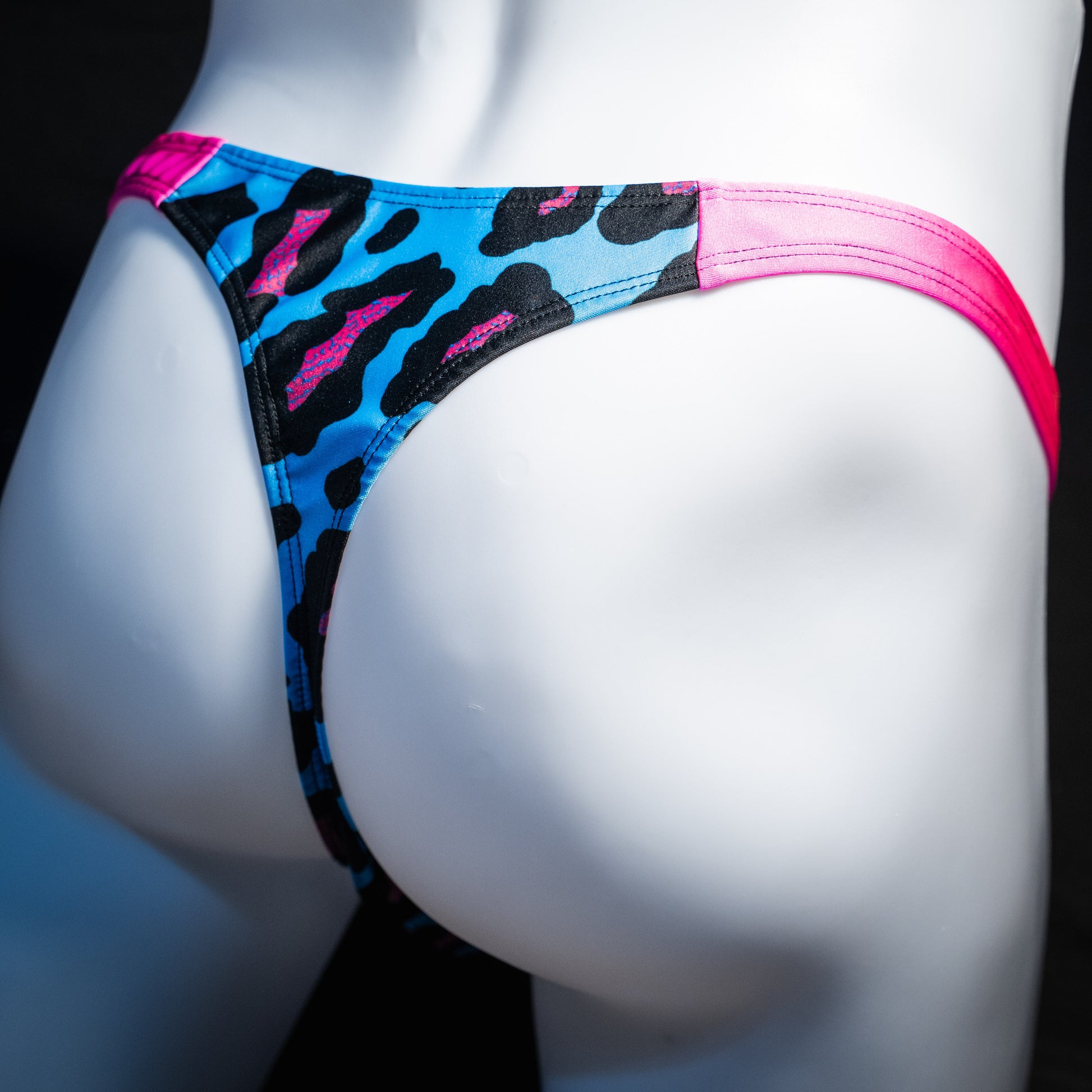 Men's blue and pint cheetah print thong underwear, full thong front, rear view.