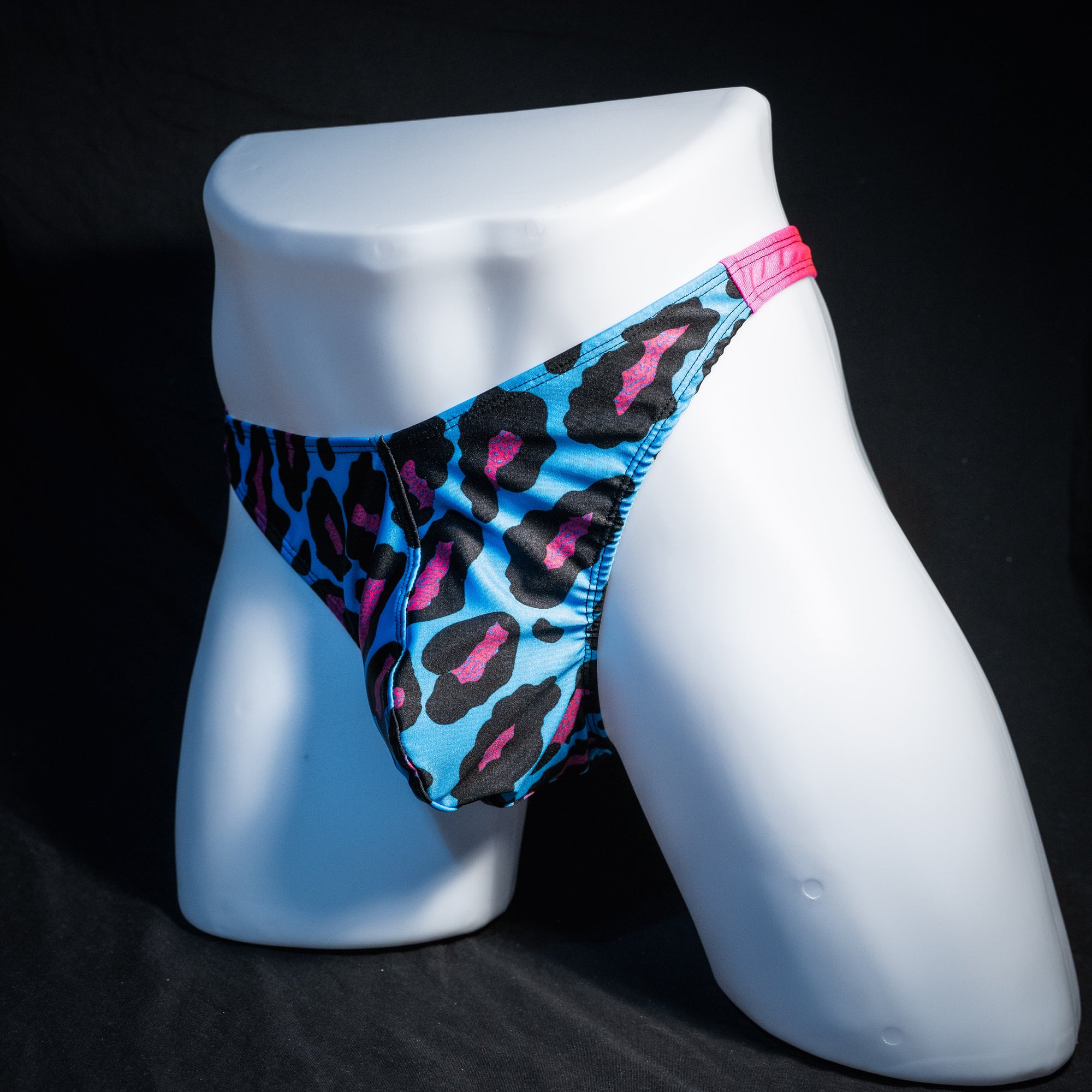Men's blue and pint cheetah print thong underwear, full thong front, front view.