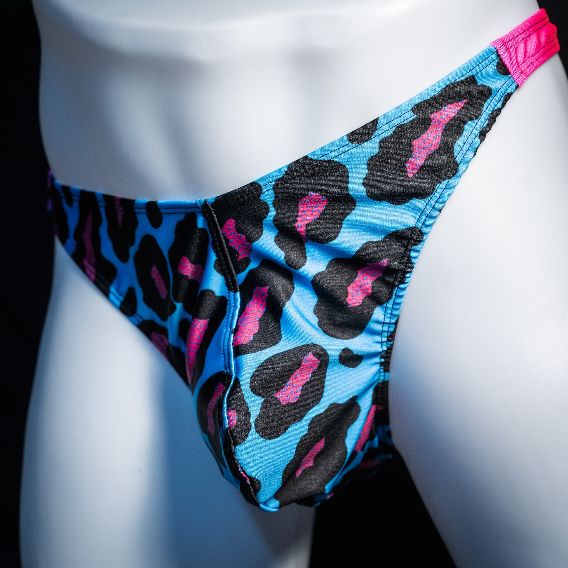 Men's blue and pint cheetah print thong underwear, full thong front, front view.