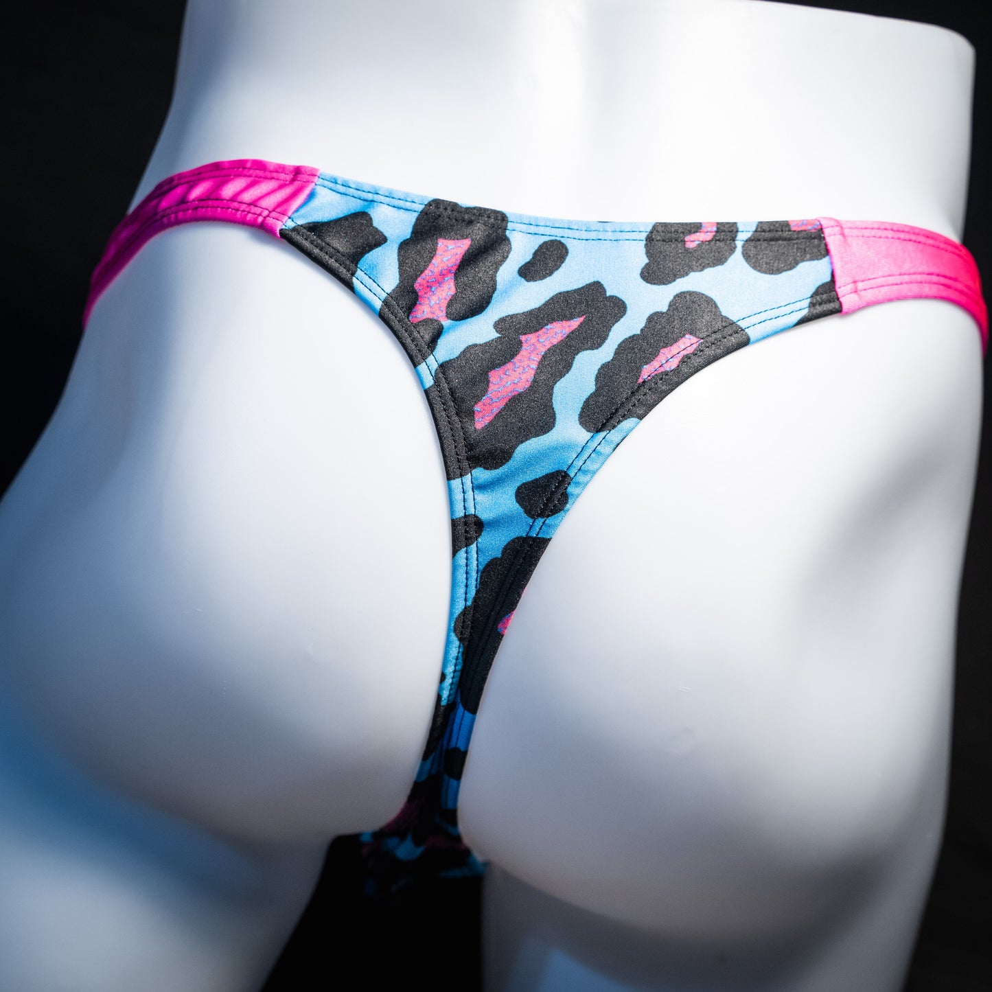 Men's blue and pint cheetah print thong underwear, full thong front, rear view.